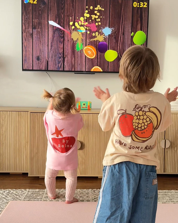 Kids enjoying Wonder Trek motion sensor game on TV.